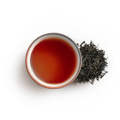 Cup of earl grey tea with black leaf image on side 